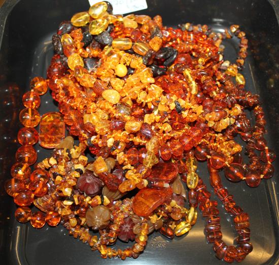 A quantity of amber and simulated amber necklaces etc.